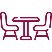 Here's an alt tag for the image: `Small table with two chairs`